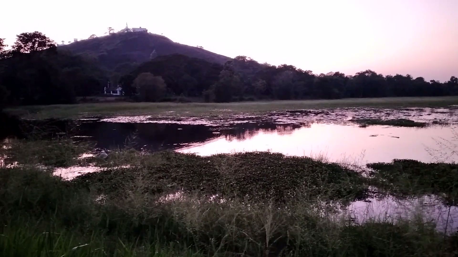 Rural village scenery at dusk near the Knuckles mountain range